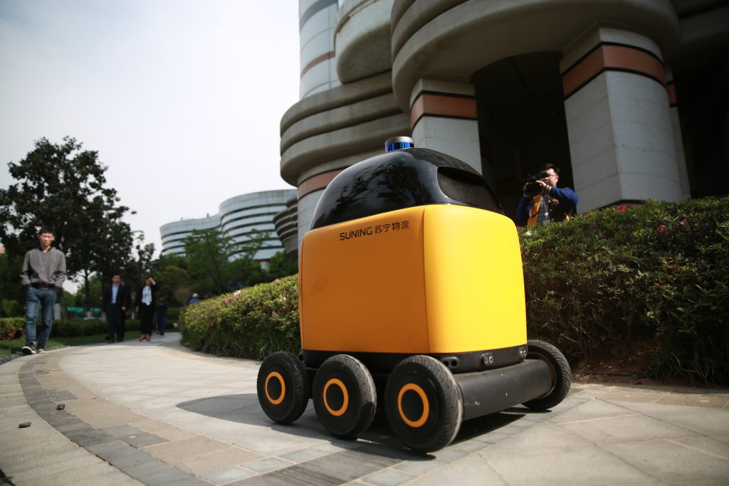 Suning launches its first autonomous robot to delivery parcels in residential area